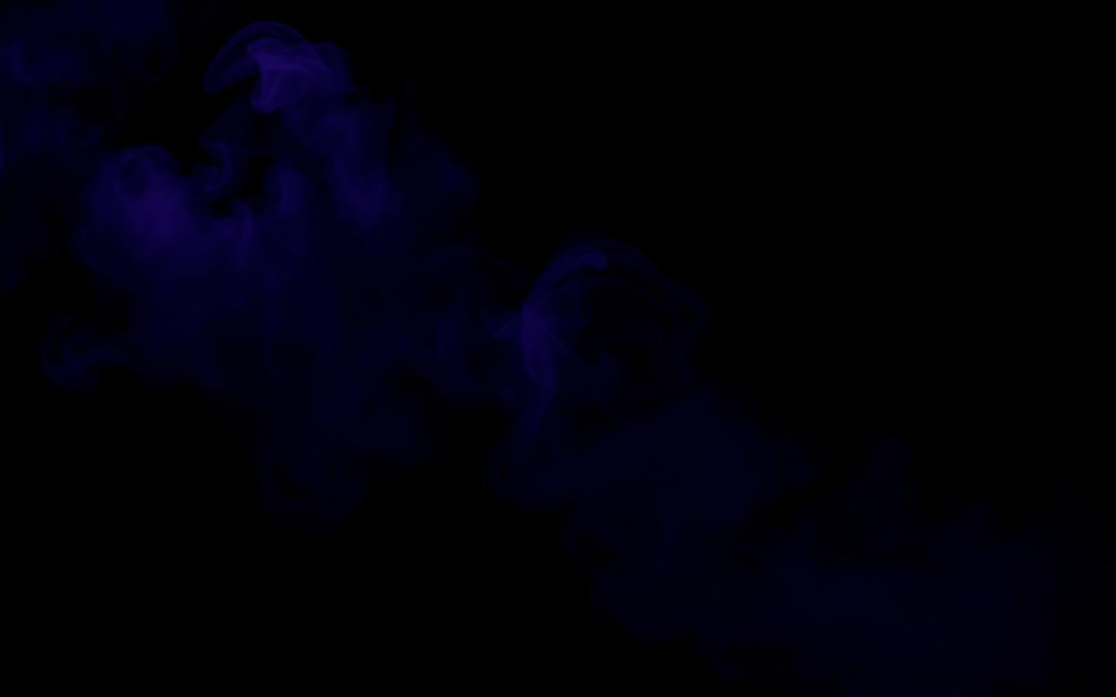 Violet smoke drifting through darkness, evoking a mediumship reading with loved ones in spirit